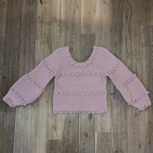 Sweater with pom-poms
